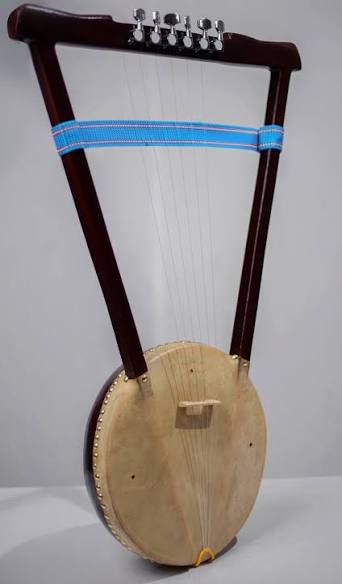 Handcrafted Master Kirar 6-string bowl-lyre with hand-finished Kerero wood body, ox-horn bridge and rawhide soundbox.